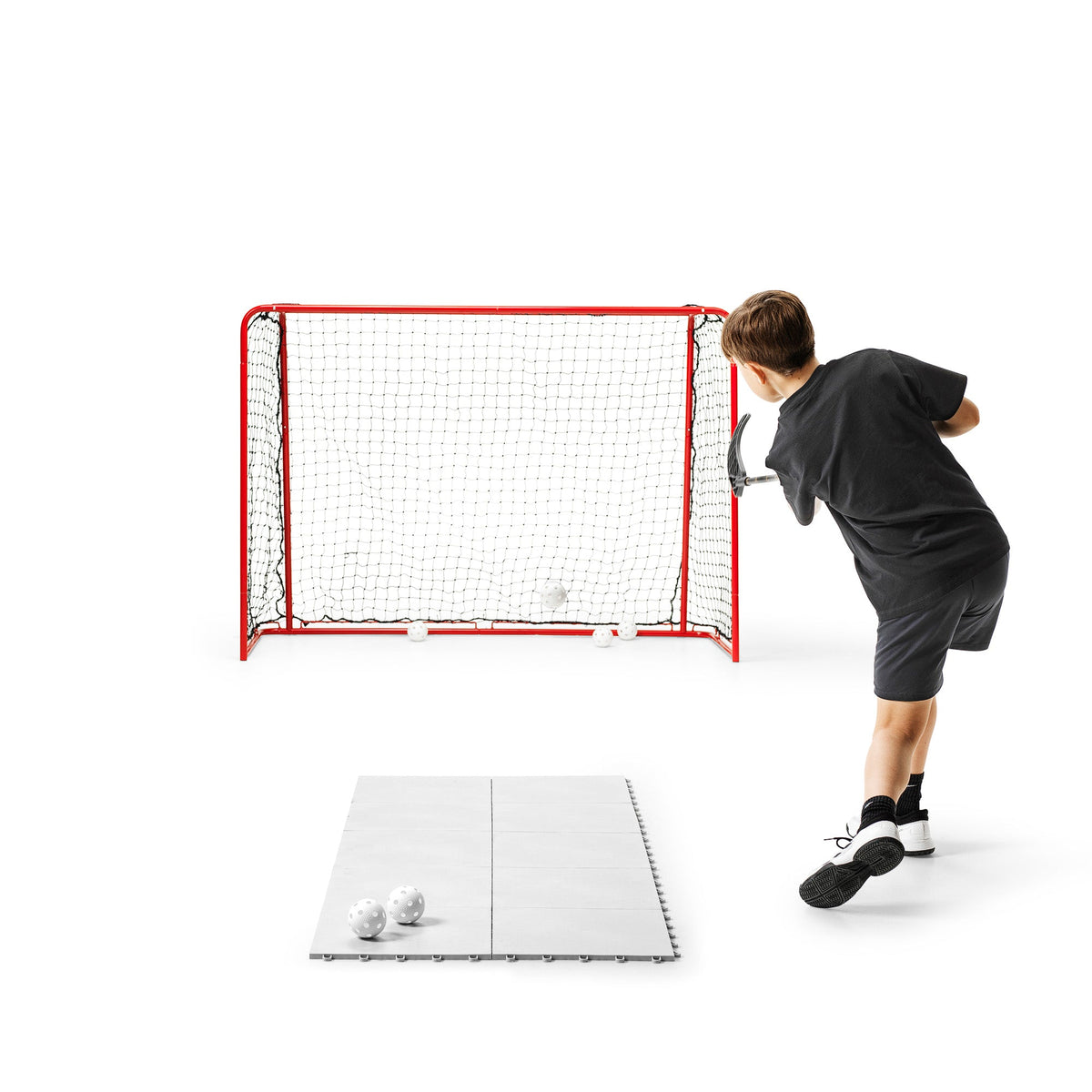 Official-size floorball goal set up outdoors for home shooting practice