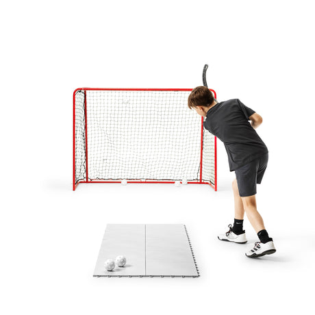 Floorball goal with tiles in front, a home shooting setup for the mid-range budget