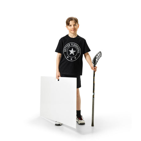 Floorball player taking a shot from a shooting pad during a daily shooting challenge