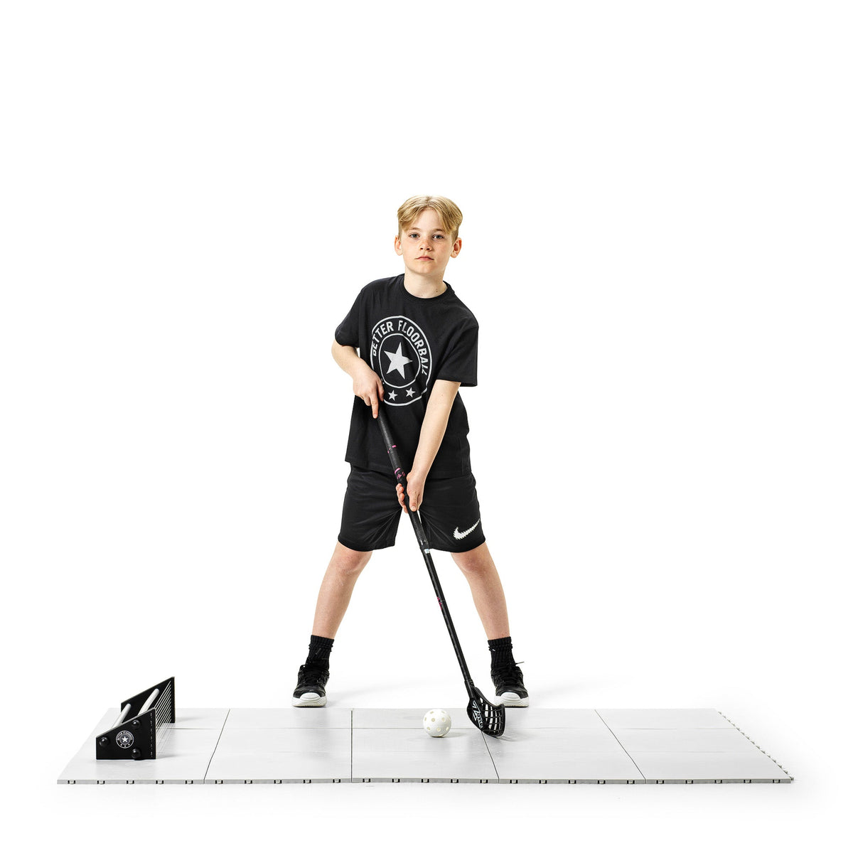 Floorball player doing a light passing session on tiles on a recovery day