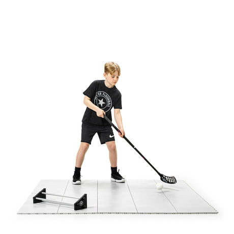 Floorball tiles laid out in a mid-sized training area for passing and shooting